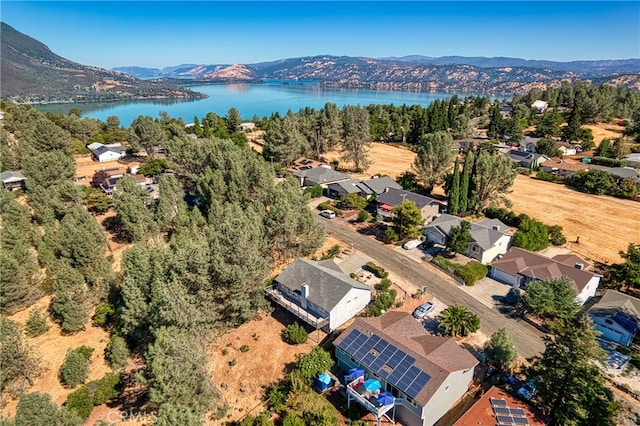 bird's eye view with a water and mountain view