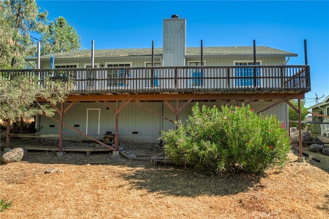 rear view of house featuring a deck