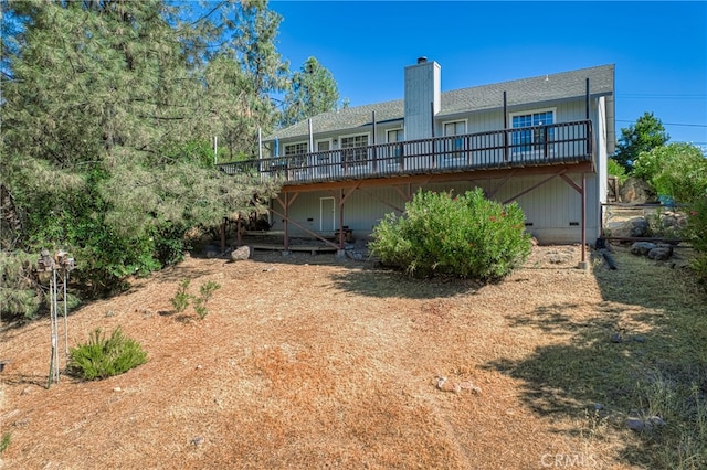 rear view of house with a wooden deck