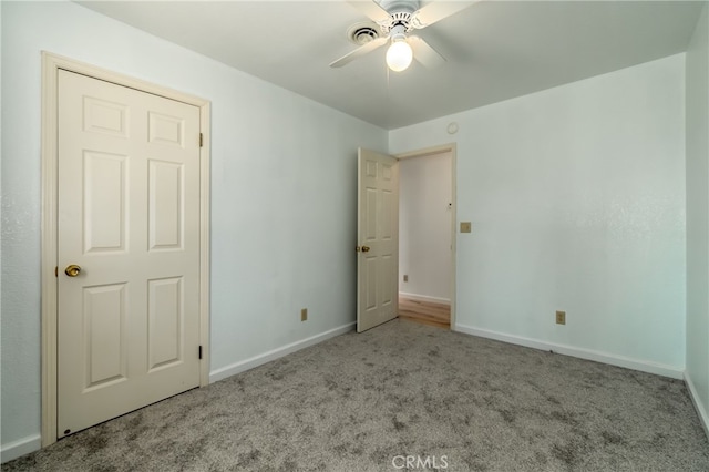 unfurnished bedroom with ceiling fan and light carpet