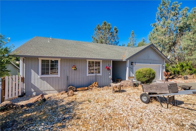 ranch-style home featuring a garage