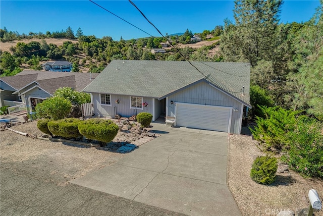 single story home featuring a garage and a porch