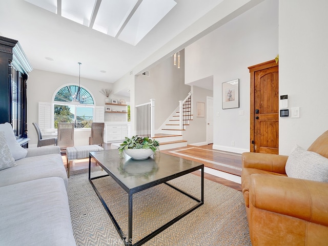 living room featuring hardwood / wood-style floors and a high ceiling