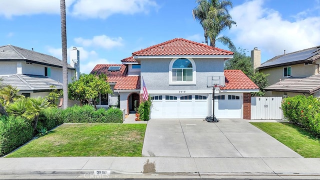 view of front of house featuring a front yard and a garage