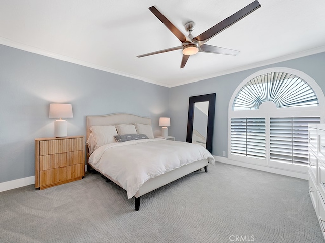 bedroom featuring ceiling fan, light colored carpet, and ornamental molding