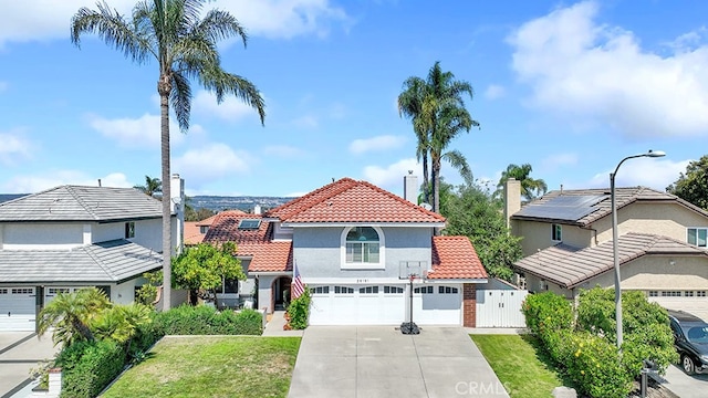 view of front facade with a front yard and a garage