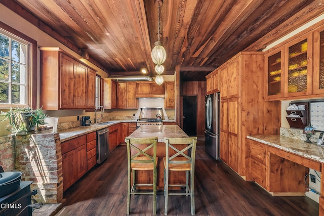 kitchen featuring appliances with stainless steel finishes, dark wood-type flooring, wooden ceiling, and a kitchen island