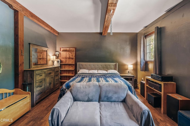 bedroom featuring beam ceiling and dark wood-type flooring