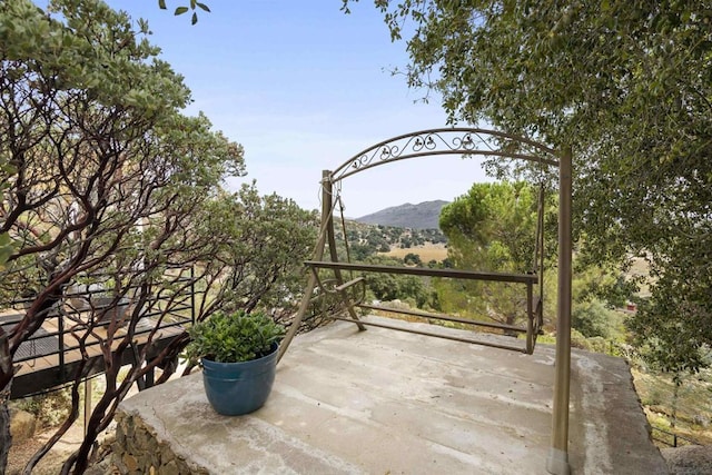 view of patio / terrace featuring a mountain view