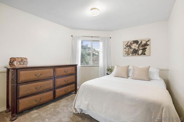 bedroom with light carpet