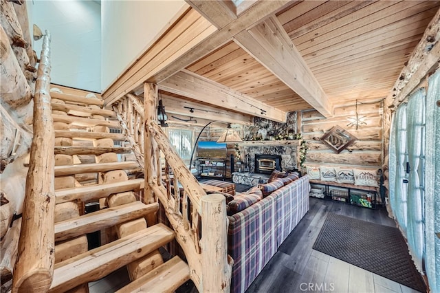 unfurnished living room featuring wood ceiling, a wood stove, rustic walls, and hardwood / wood-style floors