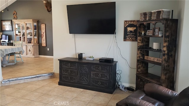 tiled living room with vaulted ceiling