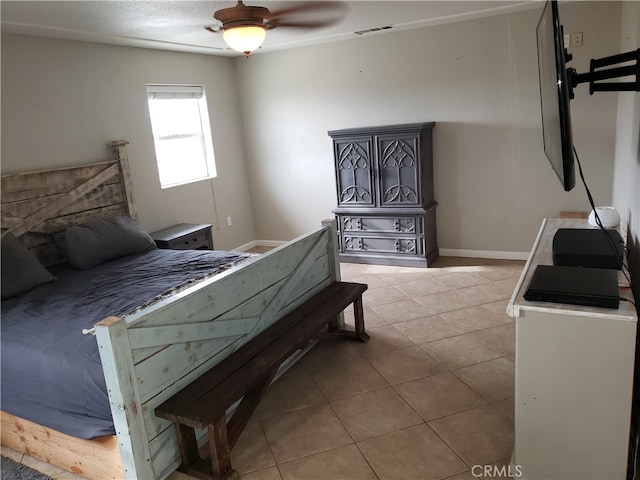 bedroom featuring light tile patterned floors and ceiling fan