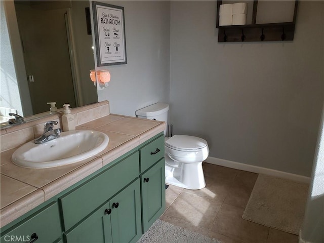 11710 Paskenta Rd, Red Bluff, CA 96080 - bathroom with toilet, vanity, tile patterned floors, and baseboards