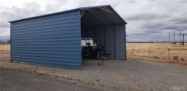 view of outbuilding with a carport