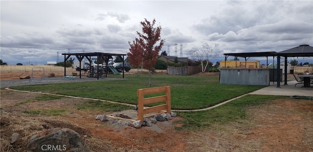 view of yard with a playground and a gazebo