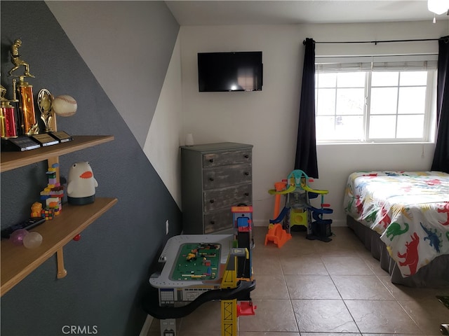 bedroom with light tile patterned floors