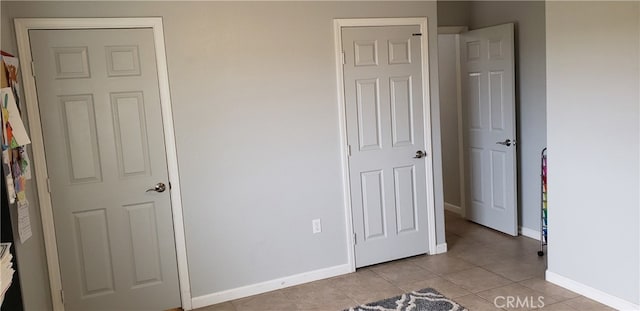 unfurnished bedroom featuring light tile patterned floors