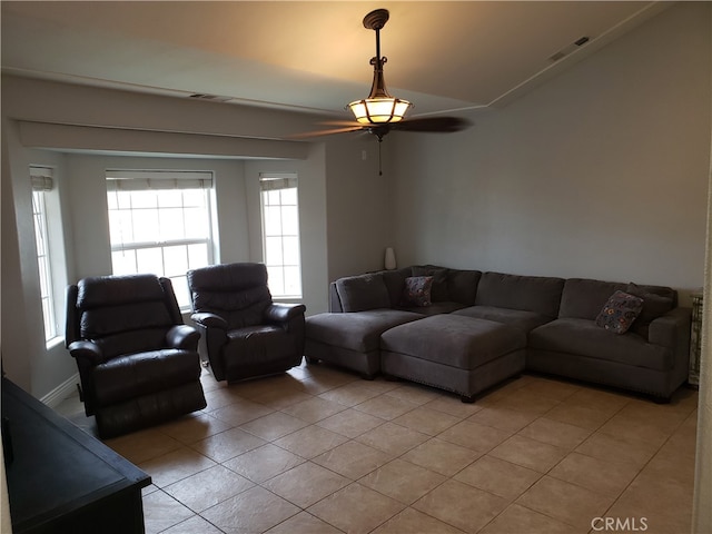 living room featuring ceiling fan and light tile patterned floors