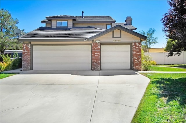 view of front facade featuring a garage and a front lawn