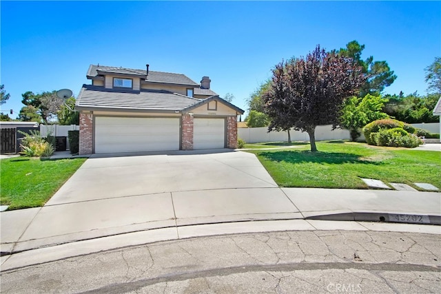 view of front of property featuring a front yard and a garage