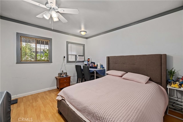 bedroom featuring light wood-type flooring, cooling unit, ornamental molding, and ceiling fan