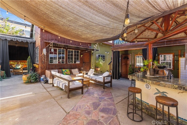 view of patio with an outdoor bar and outdoor lounge area