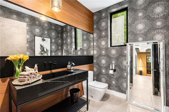 bathroom featuring vanity, toilet, and tile patterned floors