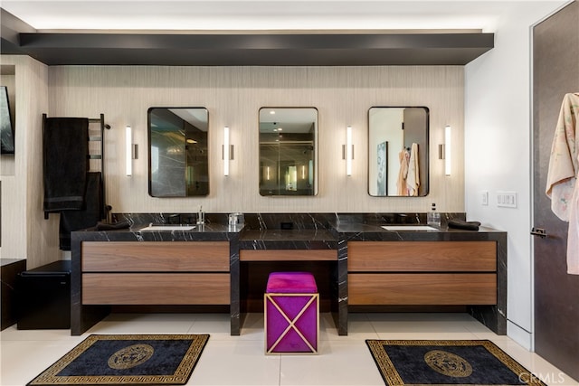 bathroom featuring tile patterned flooring and vanity