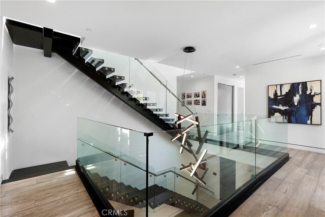 stairway featuring hardwood / wood-style floors