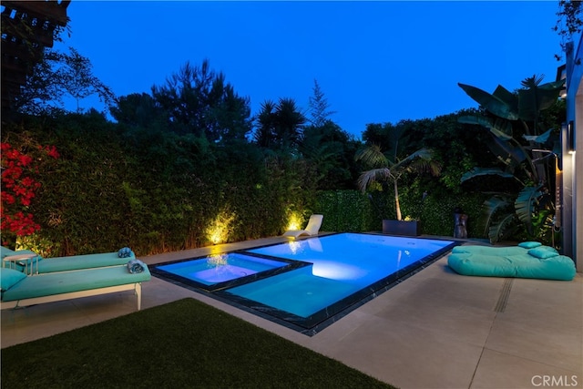 view of pool with a patio and an in ground hot tub