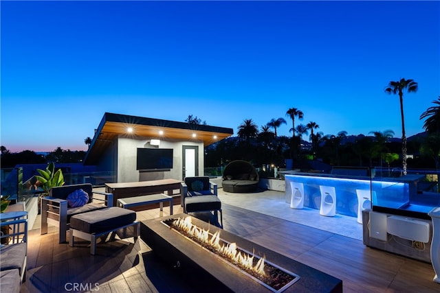 view of pool with an outdoor living space and a patio area