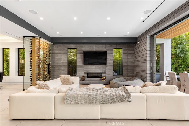 living room featuring a healthy amount of sunlight and light tile patterned floors