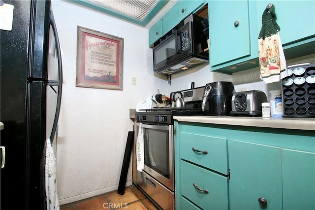 kitchen with black appliances and tile patterned flooring