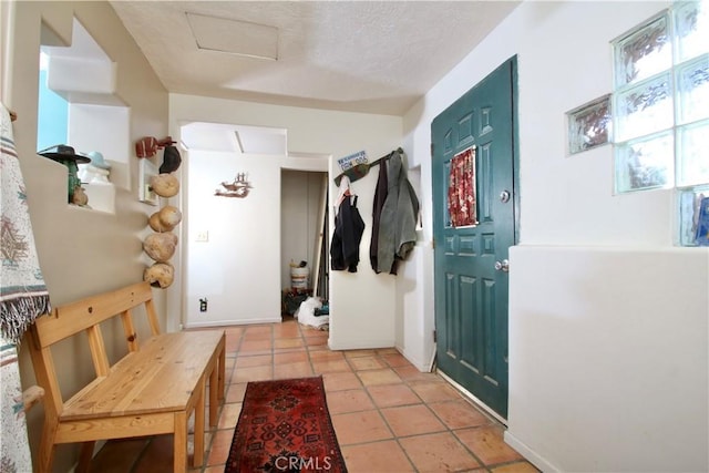 mudroom featuring light tile patterned floors