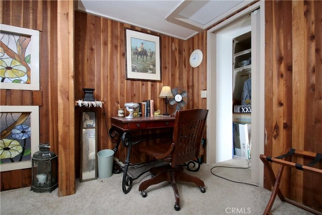 office space featuring wood walls and carpet floors