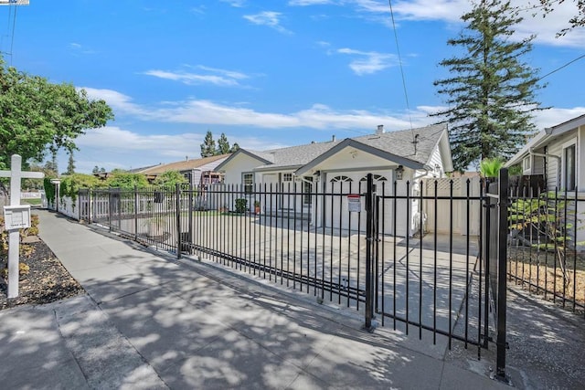 view of gate with a garage