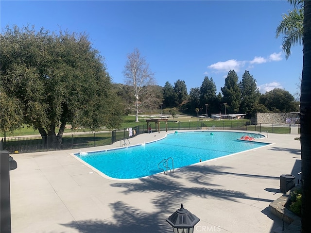 view of swimming pool featuring a patio