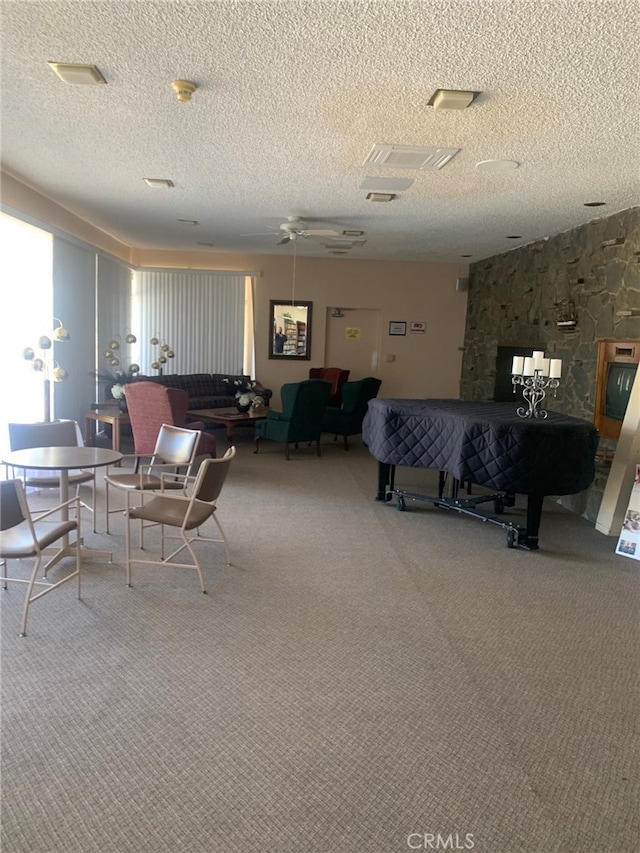 interior space with a textured ceiling and carpet