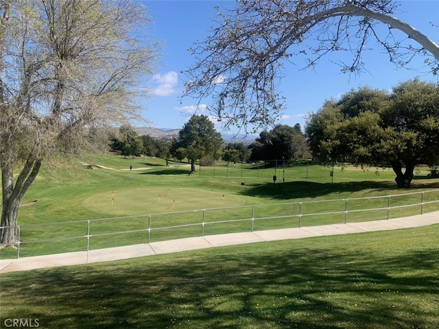 view of home's community with a lawn