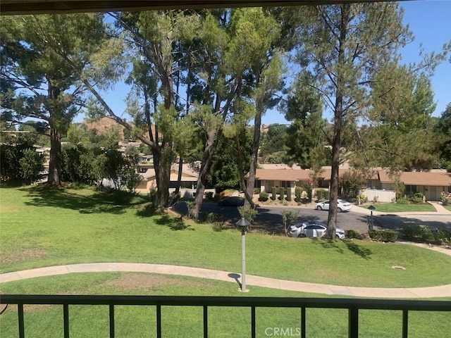 view of home's community featuring a lawn