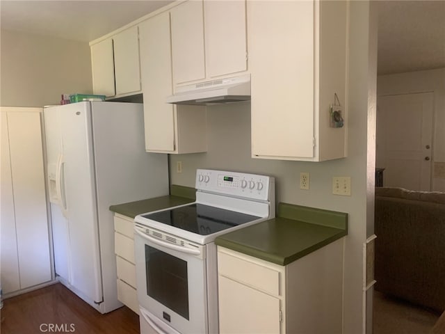 kitchen featuring electric stove, white cabinetry, and dark wood-type flooring