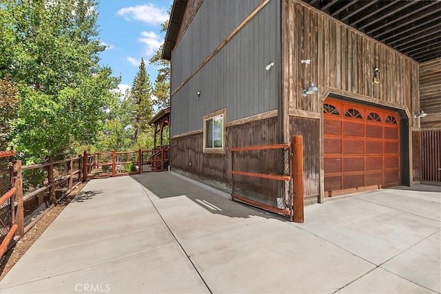 view of side of property with a garage