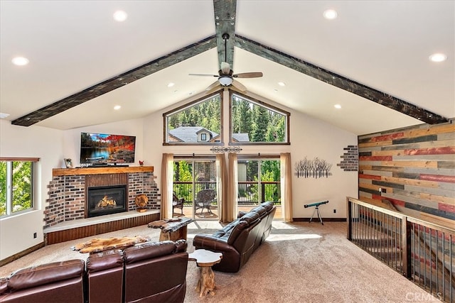 living room featuring light carpet, lofted ceiling with beams, and a wealth of natural light