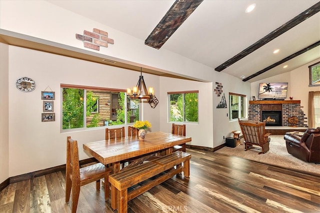 dining room with an inviting chandelier, a wealth of natural light, vaulted ceiling with beams, and wood-type flooring