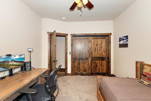 carpeted bedroom featuring ceiling fan