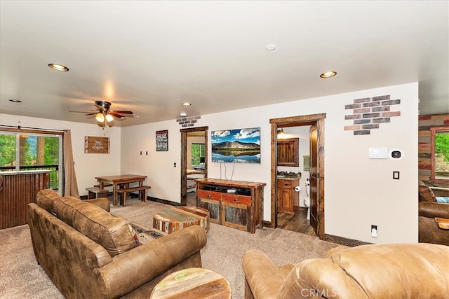 living room featuring carpet and ceiling fan