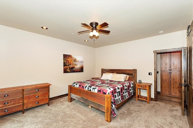 carpeted bedroom featuring ceiling fan