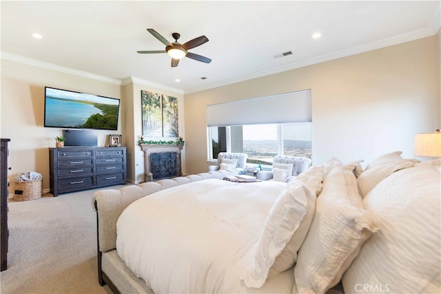 carpeted bedroom with crown molding and ceiling fan