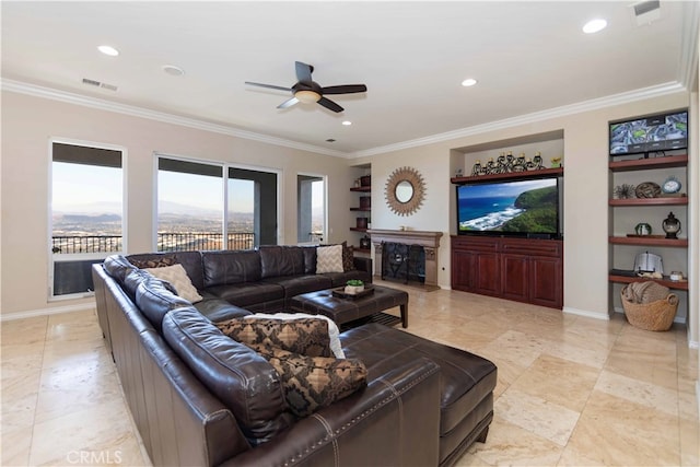 living room featuring ceiling fan and crown molding